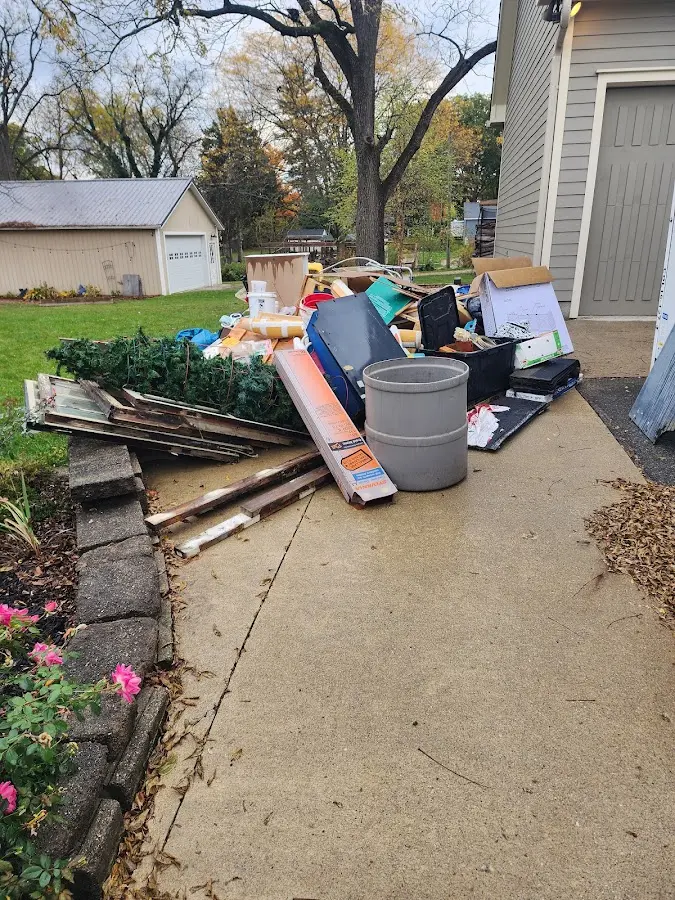 Dumpster being loaded with debris for Residential Dumpster Rental in Palmyra